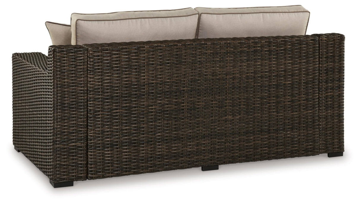 Signature Design by Ashley Coastline Bay Casual Weather Resistant Outdoor Loveseat with Cushion and 2 Throw Pillows, Beige & Dark Brown