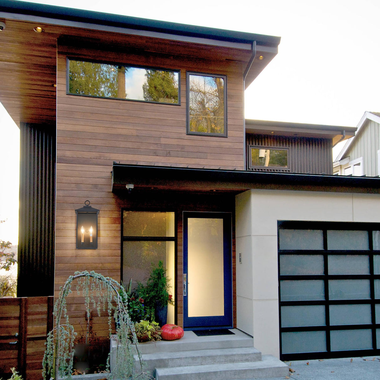 18 Inch Wall Light in Clear Glass and Textured Black and Golden Candle Cap Sleeve