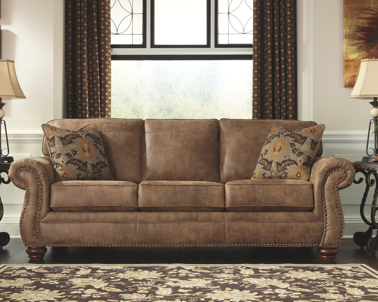 Larkinhurst Faux Leather Sofa with Nailhead Trim and 2 Accent Pillows, Brown