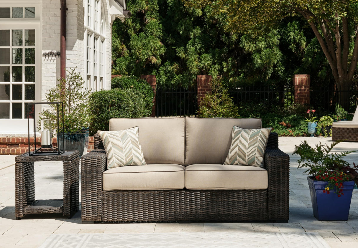 Signature Design by Ashley Coastline Bay Casual Weather Resistant Outdoor Loveseat with Cushion and 2 Throw Pillows, Beige & Dark Brown