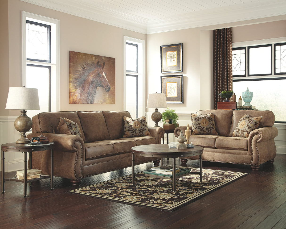 Larkinhurst Faux Leather Sofa with Nailhead Trim and 2 Accent Pillows, Brown