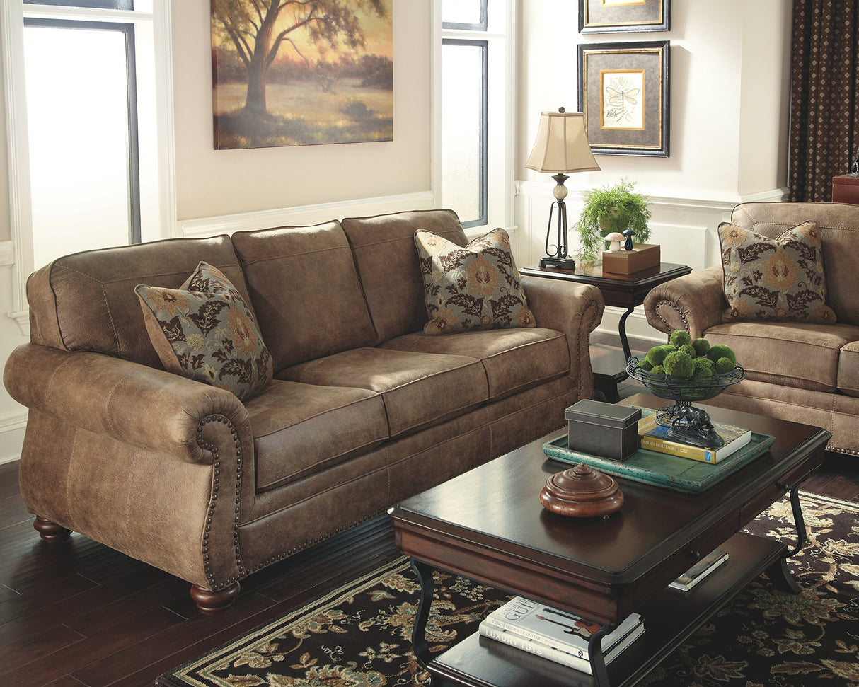Larkinhurst Faux Leather Sofa with Nailhead Trim and 2 Accent Pillows, Brown