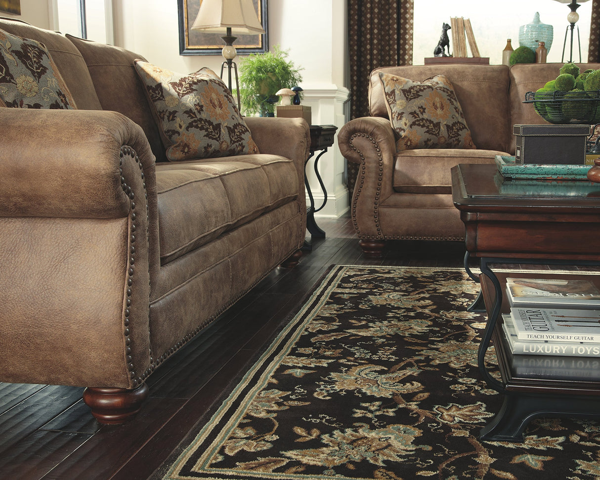 Larkinhurst Faux Leather Sofa with Nailhead Trim and 2 Accent Pillows, Brown
