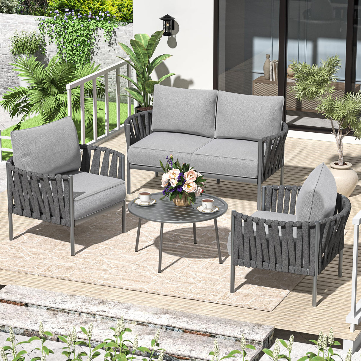 Modern grey 4-piece patio conversation set with metal frame and round table