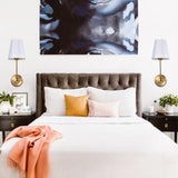 Hardwired Wall Sconce with Flared Shape White Textile Shade Curved Arm and Antique Brass Finish Metal Base
