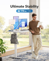 HUANUO Electric Standing Desk, 48" x 24" Whole Piece Desktop, Adjustable Height Computer Desk, 4 Height Memory Settings, Sit Stand Up Desk for Home Office, White