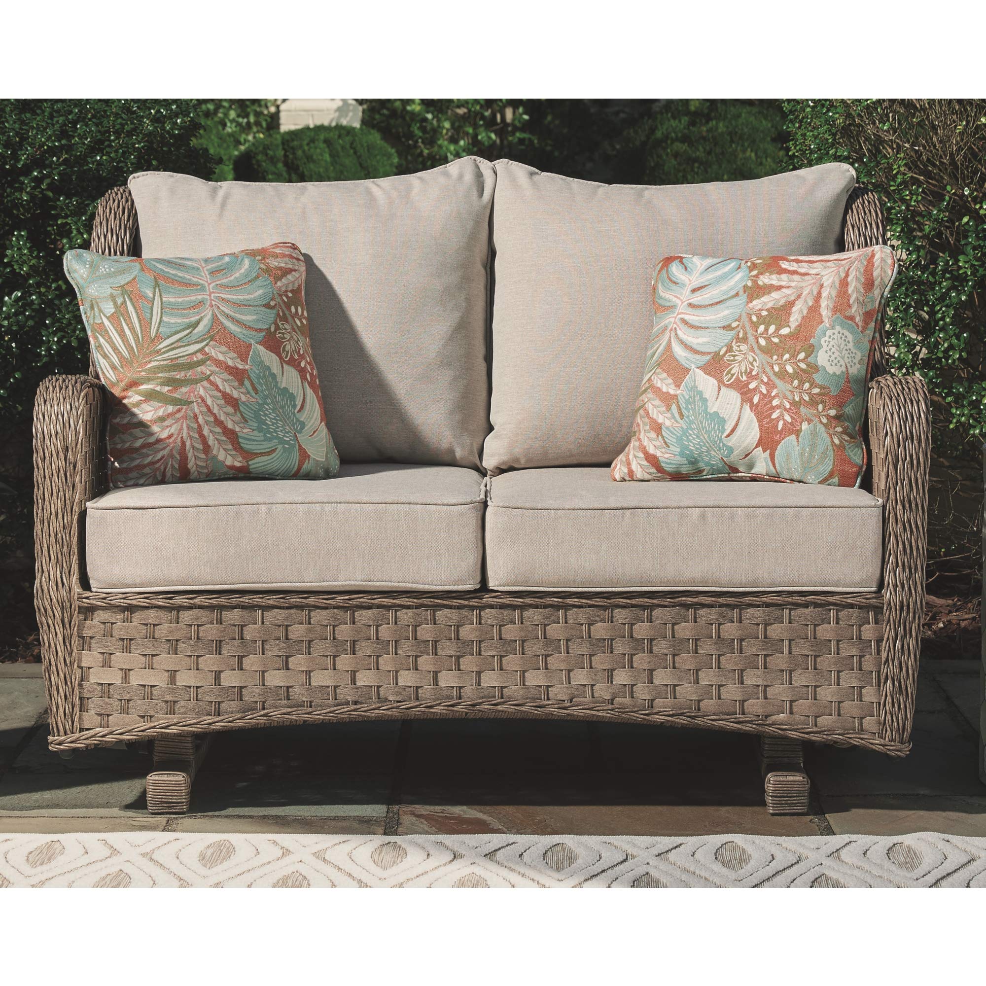 by Ashley Clear Ridge Outdoor Handwoven Wicker Cushioned Loveseat Glider with 2 Throw Pillows, Light Brown