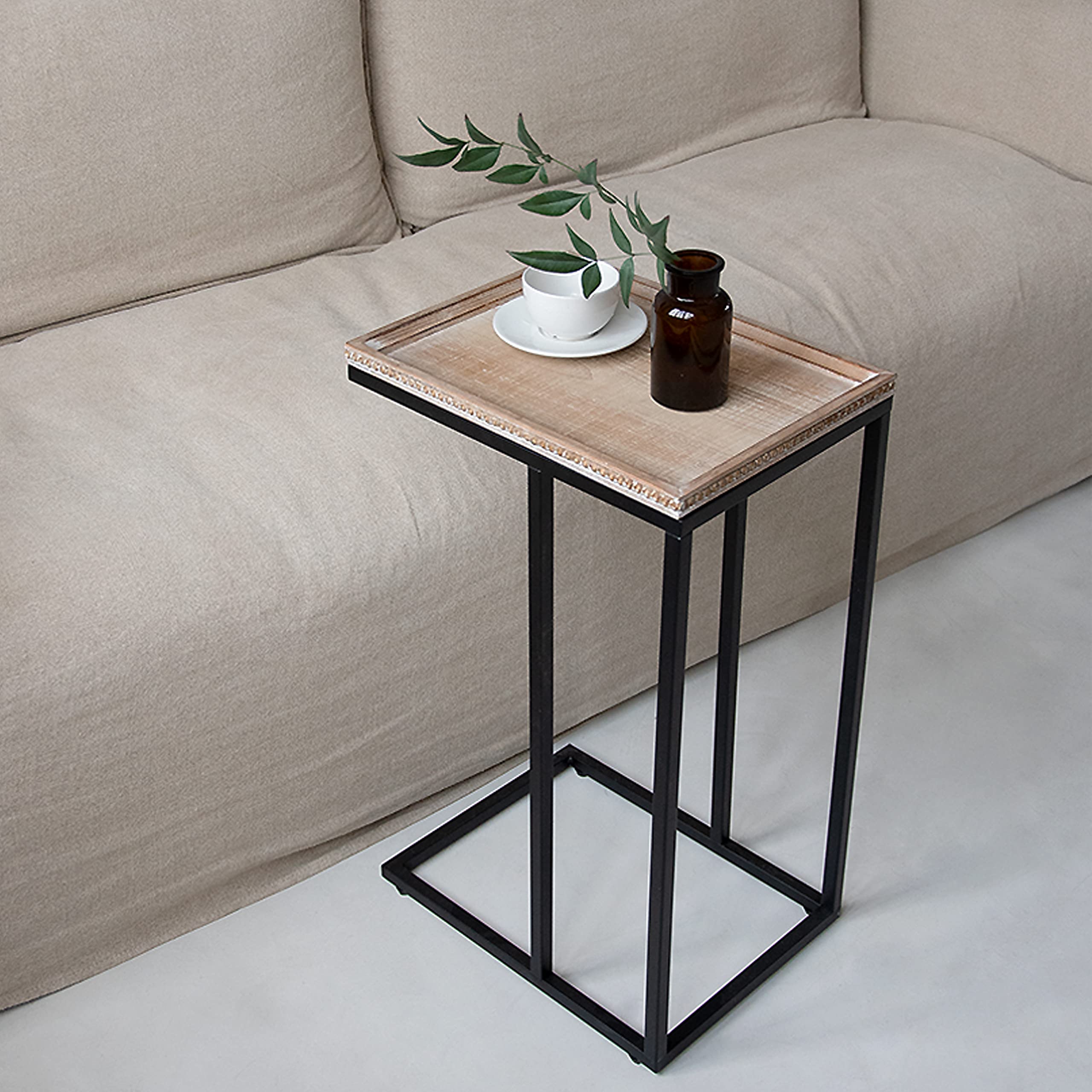Minimalist C-table design in a modern living room setting