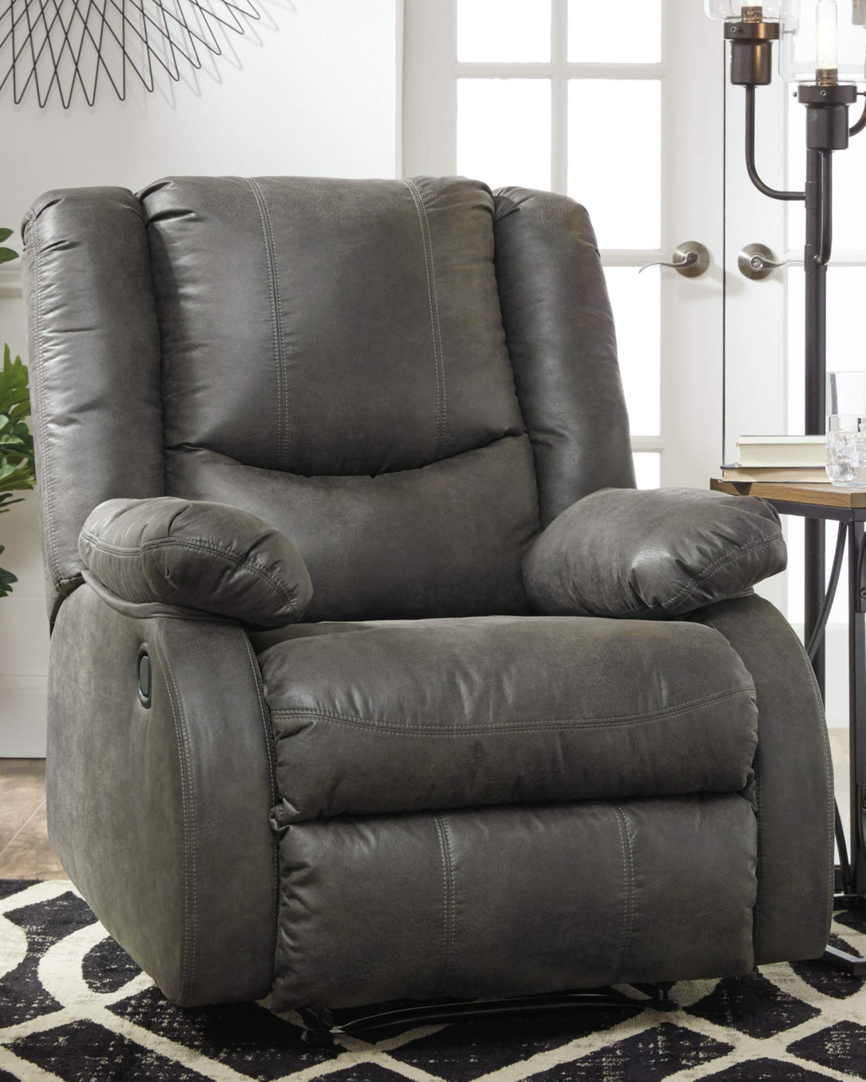 Side Angle of Faux Leather Recliner in Slate with Pull-Tab Recline