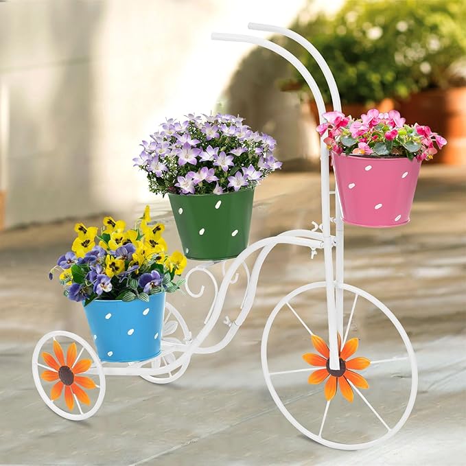 white metal bicycle plant holder with colorful flower buckets